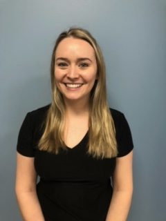 Headshot of a young adult female in a black shirt