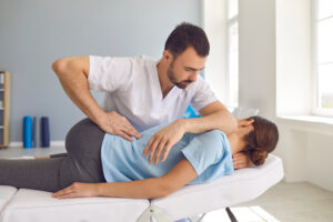 a woman getting a back massage from a man