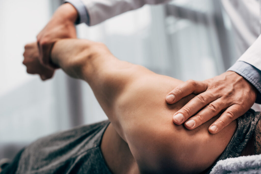a man getting a back massage from a woman