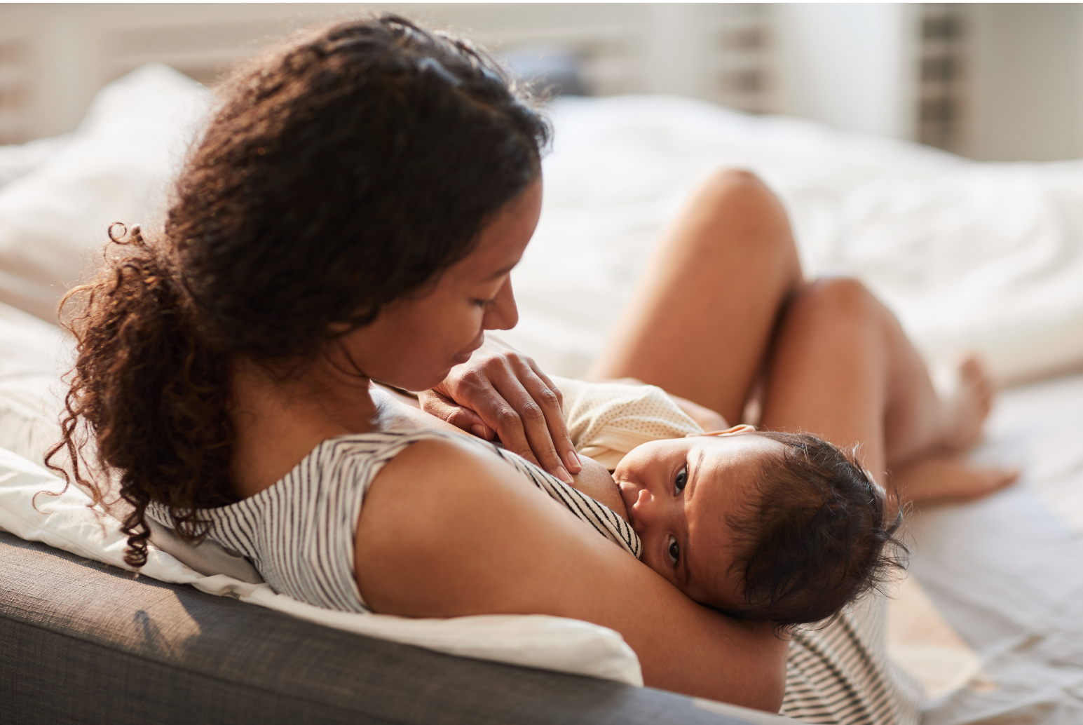 a woman holding a baby on her lap
